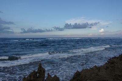 Scenic view of sea against blue sky