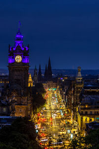 Illuminated buildings in city at night