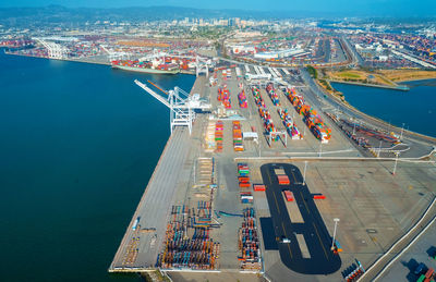 High angle view of commercial dock by city