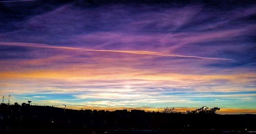 Silhouette landscape against sky during sunset