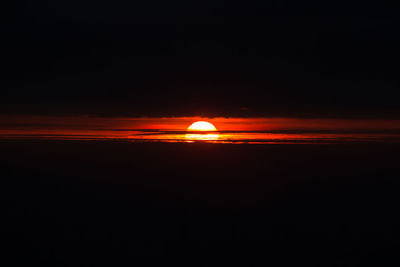 Illuminated orange sky at night