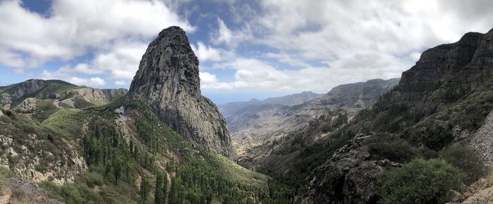 Panoramic view of rocky mountains against sky