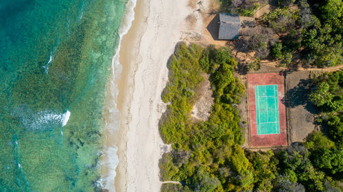 Aerial view of the tennis court next to the ocean in dar es salaam