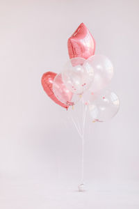 Close-up of balloons against white background