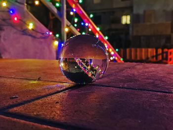 Close-up of illuminated ball on table