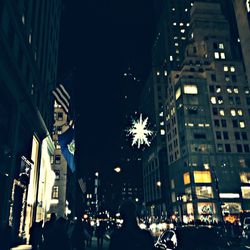 Illuminated city street at night