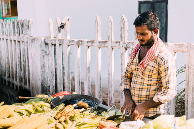 Young man looking at food