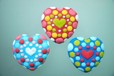 Heart shape gingerbread cookies against turquoise background