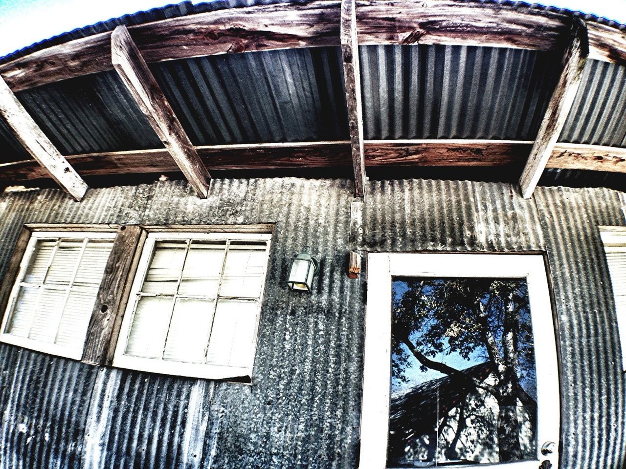 architecture, built structure, building exterior, low angle view, window, building, old, pattern, day, glass - material, metal, no people, outdoors, abandoned, sky, house, residential structure, damaged, full frame, architectural feature