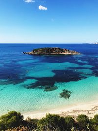 Scenic view of sea against clear blue sky
