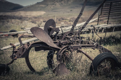 Abandoned motorcycle on field