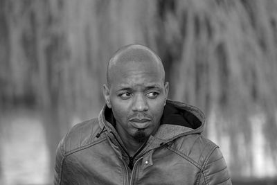 Portrait of young man standing outdoors