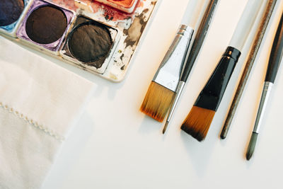 High angle view of paintbrushes on table