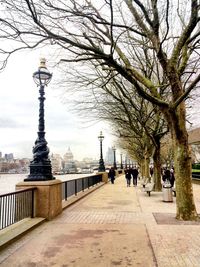 Tourists walking on riverbank