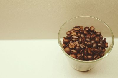 Close-up of coffee beans on table