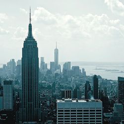 Modern buildings in city against sky