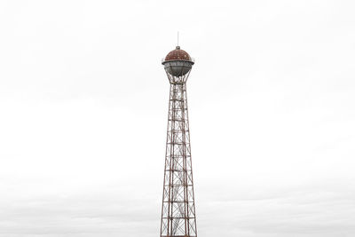 Low angle view of communications tower against clear sky