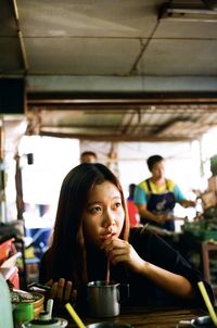 Portrait of woman sitting at restaurant