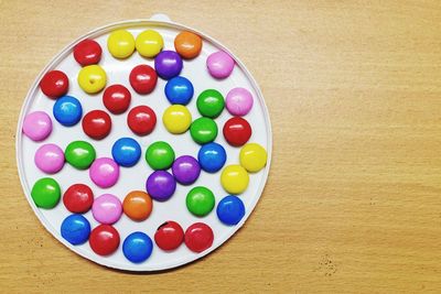 High angle view of multi colored chocolate balls on table