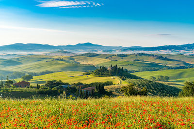 Scenic view of landscape and mountains against sky