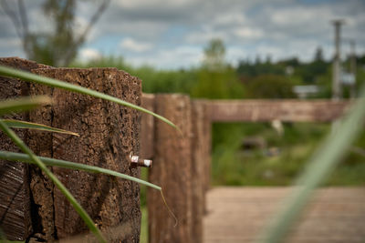 Close-up of wooden fence on field