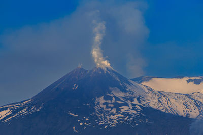 Scenic view of snowcapped etna volcano against sky