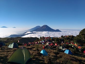 Scenic view of mountains against clear blue sky