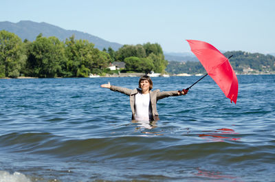 Portrait of man in sea against sky