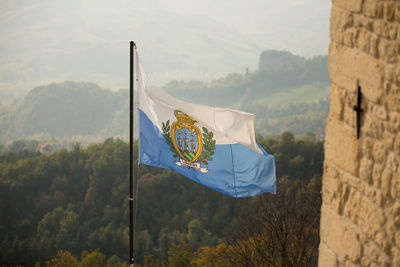 Scenic view of flag and mountains