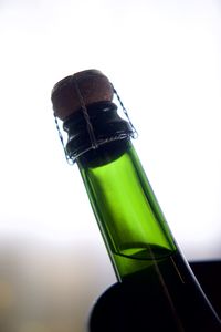 Close-up of beer bottle against white background