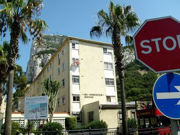 Close-up of road sign against clear sky