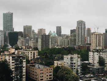 High angle view of buildings in city against sky