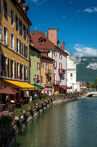 Facade of old and colorful buildings facing the canal at annecy, france.