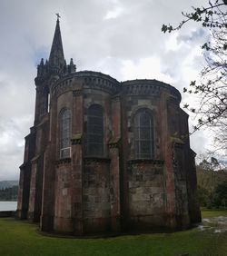 Exterior of historic building against sky
