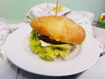 Close-up of burger in plate on table