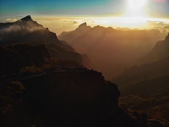 Scenic view of mountains against sky during sunset