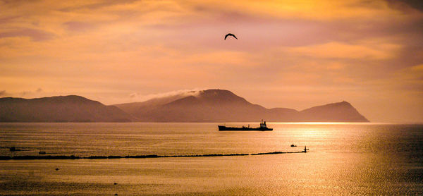 Scenic view of sea against sky during sunset