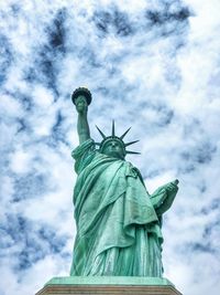 Low angle view of statue against cloudy sky