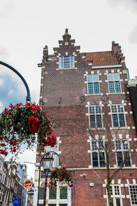 Low angle view of red building against sky