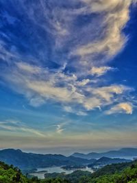 Scenic view of landscape against blue sky