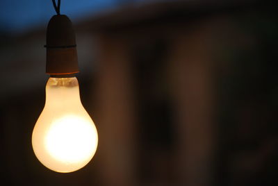 Close-up of illuminated light bulb