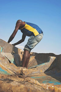 Midsection of man against clear sky