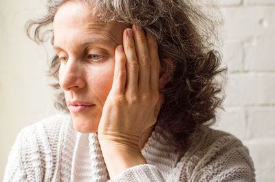 Close-up of thoughtful woman looking away