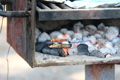 Close-up of firewood on barbecue grill