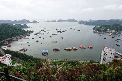 High angle view of boats in sea against sky