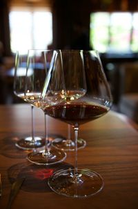 Close-up of wine glasses on table