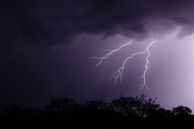 Lightning and dark, moody clouds over the desert during monsoon storm