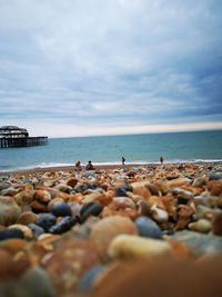 Rocks on beach against sky