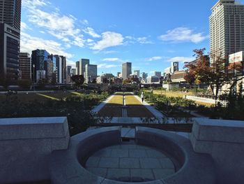 Modern buildings in city against sky