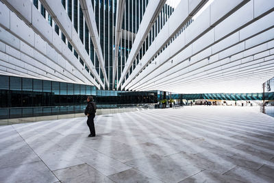 Full length of man walking in modern building